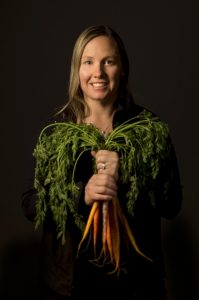 Paulette Phlipot holding carrots